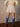 High rise mini tulle skirt with ruffled layers, bow accents, thick elastic waistband, and double lining.
